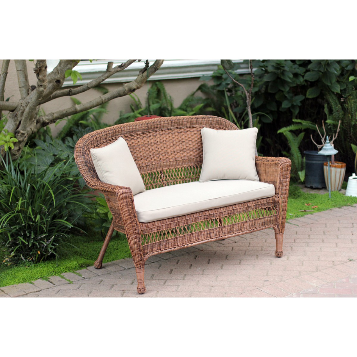 Honey Wicker Patio Love Seat With Tan Cushion and Pillows