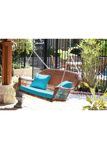 Honey Resin Wicker Porch Swing with Sky Blue Cushion