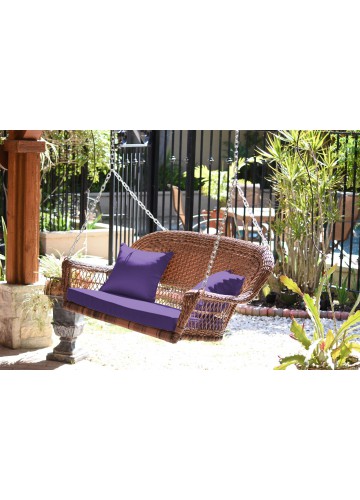 Honey Resin Wicker Porch Swing with Purple Cushion