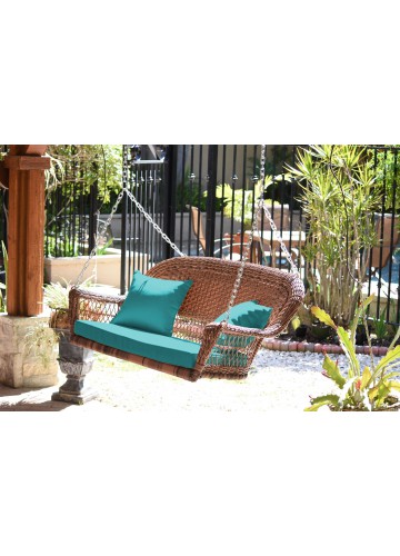 Honey Resin Wicker Porch Swing with Turquoise Cushion