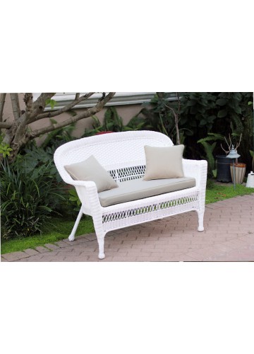 White Wicker Patio Love Seat With Tan Cushion and Pillows