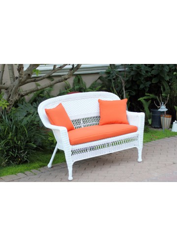 White Wicker Patio Love Seat With Orange Cushion and Pillows