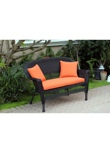 Black Wicker Patio Love Seat With Orange Cushion and Pillows