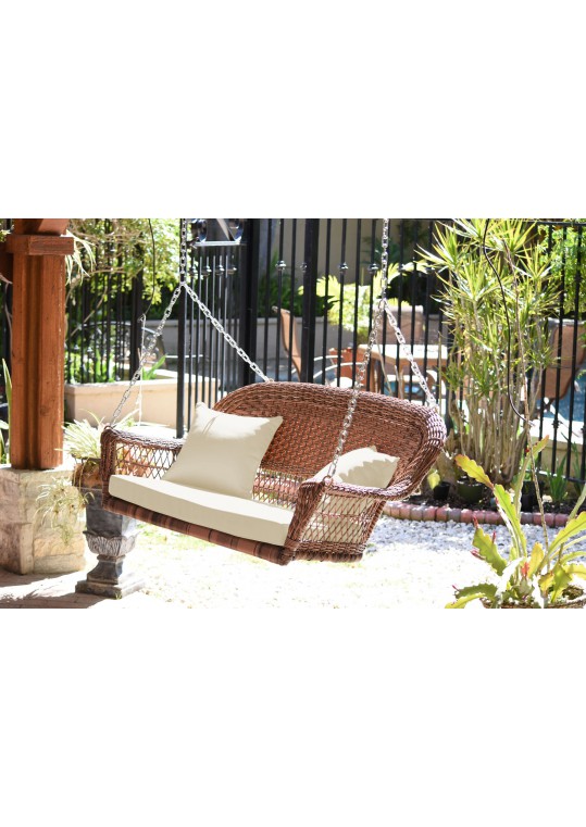 Honey Resin Wicker Porch Swing with Ivory Cushion