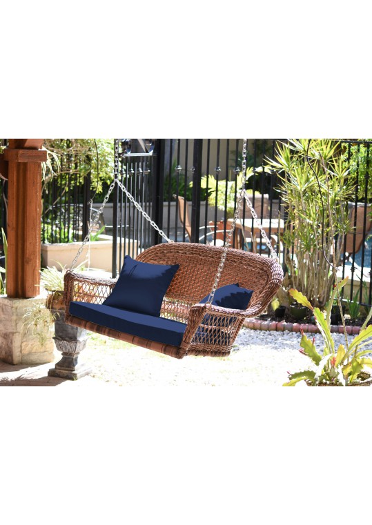 Honey Resin Wicker Porch Swing with Midnight Blue Cushion