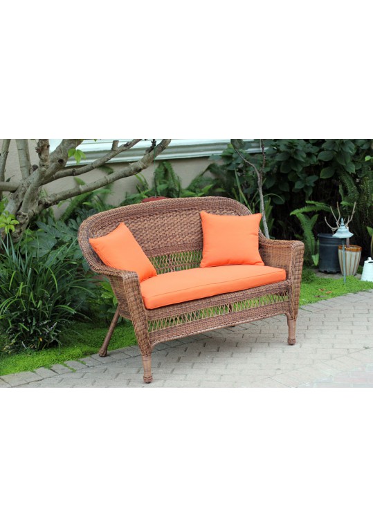 Honey Wicker Patio Love Seat With Orange Cushion and Pillows